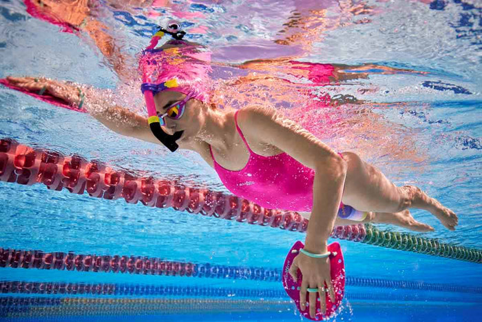 Amani Womens Pixie Proback One Piece Swimsuit in pink, featuring a sleek design and supportive fit, ideal for swimming or beachwear.