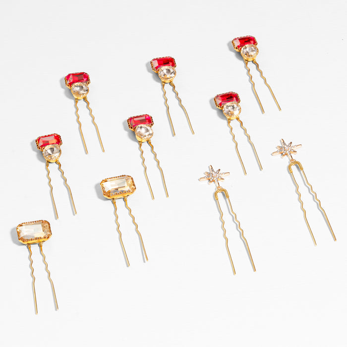 Ruby crystal pins with silver star accents styled along sleek bun