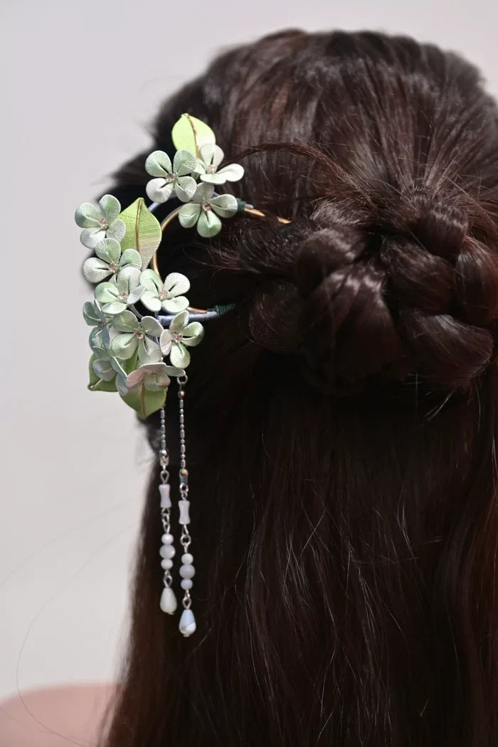 A woman wearing a handmade Chanhua silk hydrangea hairpin with beaded tassels-6