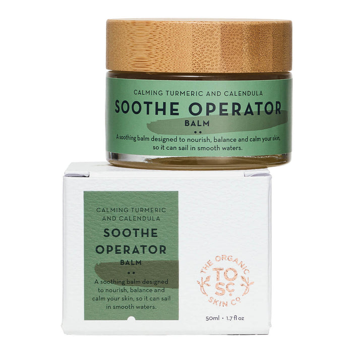 Jar of certified organic calming turmeric and calendula multitasking balm on top of its jar.
