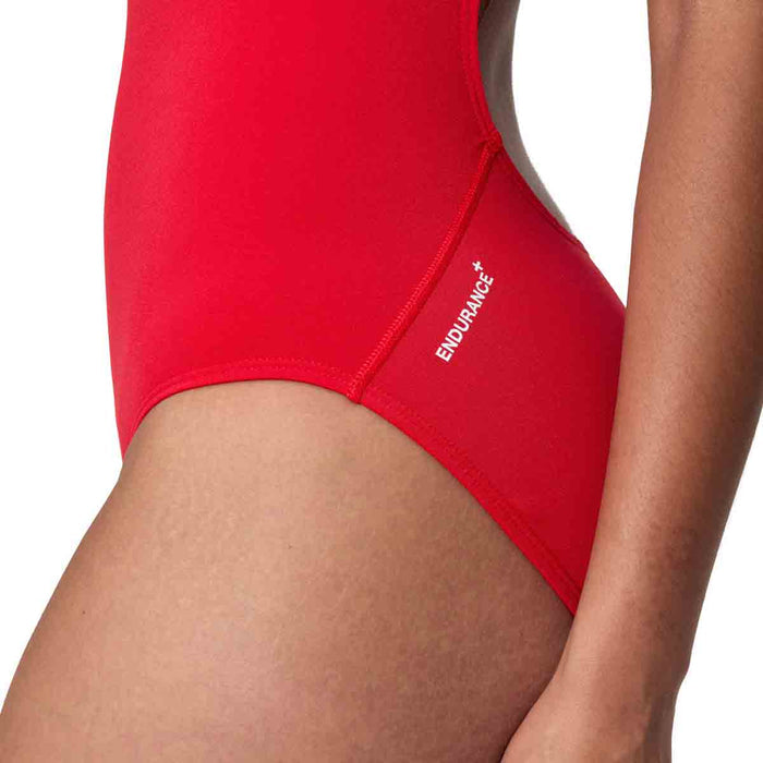 Speedo Women's Endurance+ Logo Thin Strap Swimsuit in High Risk Red, featuring sleek design and adjustable straps for swimming.