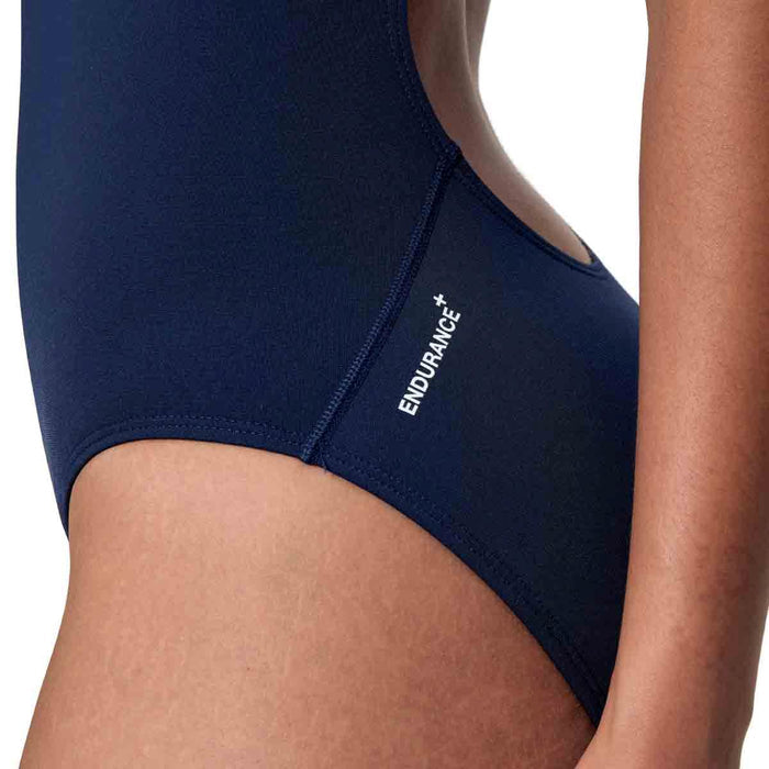 Speedo women's Endurance+ logo thin strap swimsuit in peacoat, sleek swimwear with minimal straps and bold brand logo.