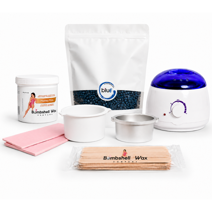 Kit with Bombshell bluE depilatory hard wax, soft wax, wax warmer, wax sticks, wax strips, and an empty hard wax tin