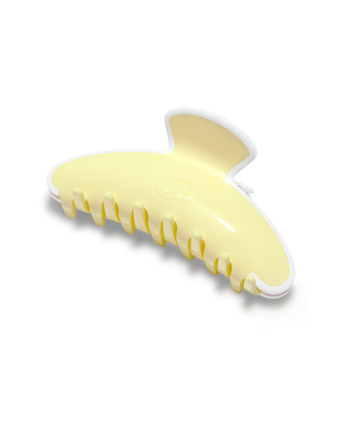 Yellow hair clip on a white background