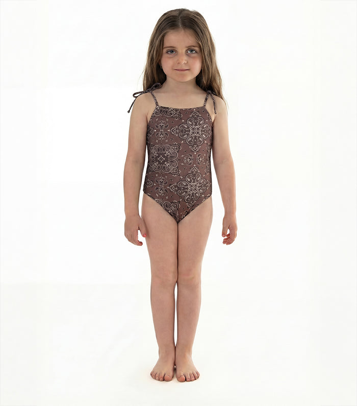 brown bandana pre order Young girl wearing a patterned swimsuit on a white background
