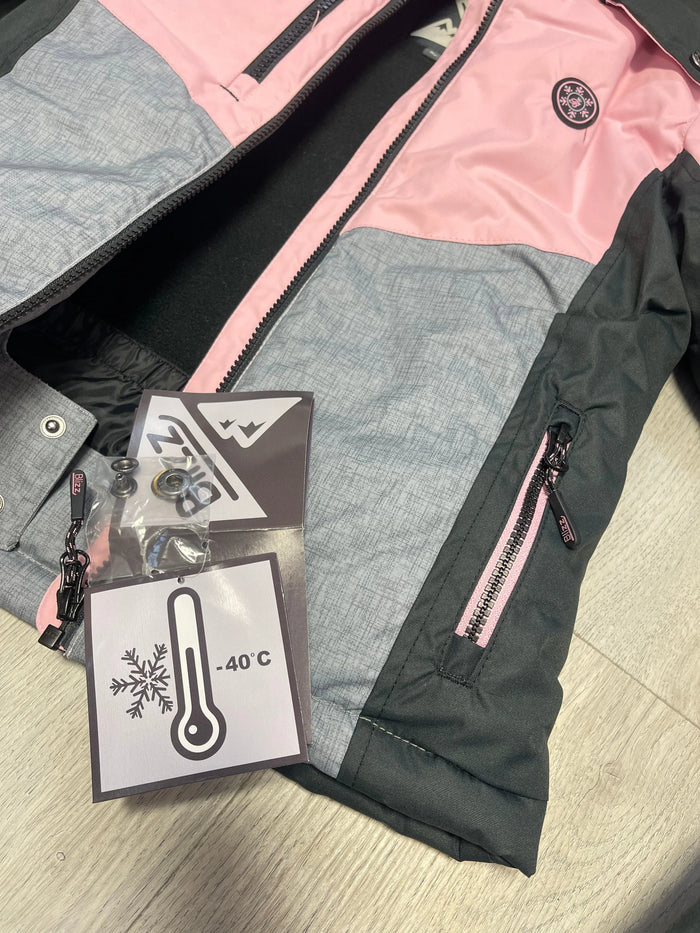 Close-up of Blizz girls Cameo Pink snowsuit showing zipper, tags, and reinforced jacket details.