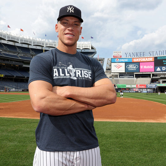 Aaron Judge wearing the ALL RISE Tee at Yankee Stadium