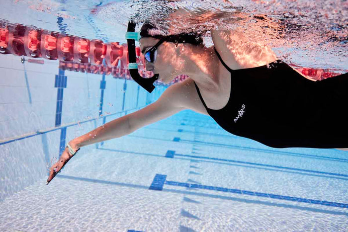 Amani Womens Jet Proback One Piece swimsuit in black, featuring a sleek design and supportive fit for women.