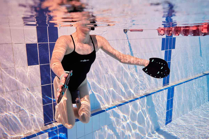 Amani Women's Jet Proback Black One-Piece Swimsuit, front view showing sleek black design and high neckline.