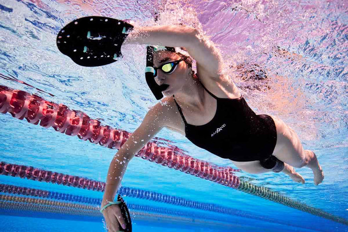 Amani Women's Jet Proback Black One-Piece Swimsuit, front view showing sleek black design and supportive fit.