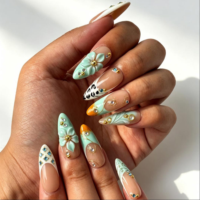 Fresh summer mint floral press‑on nails close‑up hand shot