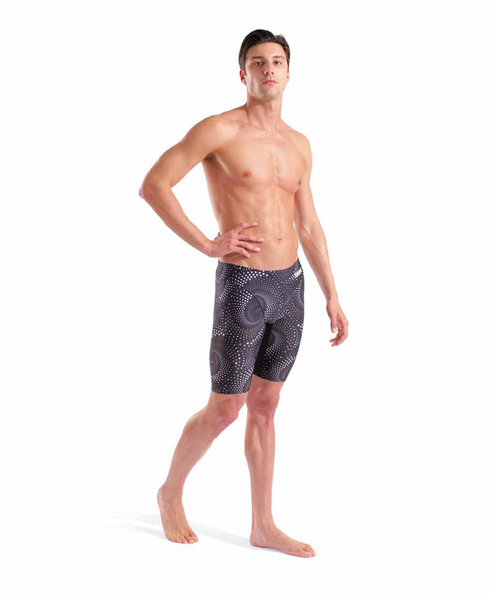 Arena men's Fireflow swim jammer in black and team black, close-up view of the fitted swimwear with logo details.