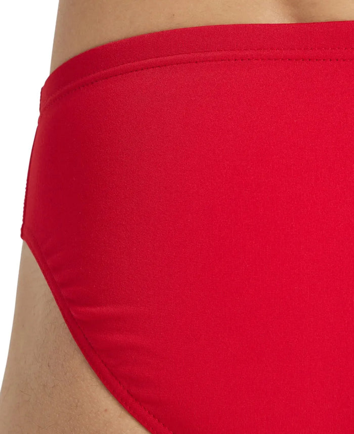 Arena men's team swim solid briefs, close-up of navy blue swim briefs with the Arena logo, designed for competitive swimming.