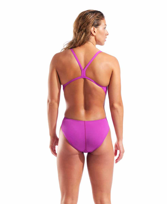 Arena women's solid Team Challenge swimsuit in vibrant fuchsia and green, designed for competitive swimming.