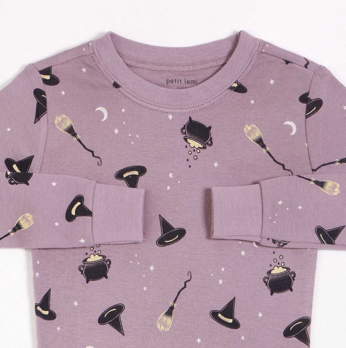 Close-up of Petit Lem girls Bewitched pajama set with witch hat print, ribbed cotton fabric, and elastic cuffs.