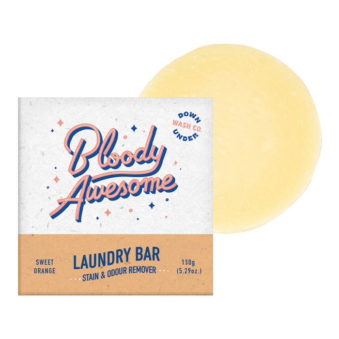 Box of sweet orange laundry bar, designed to remove stains and odours, next to the bar.