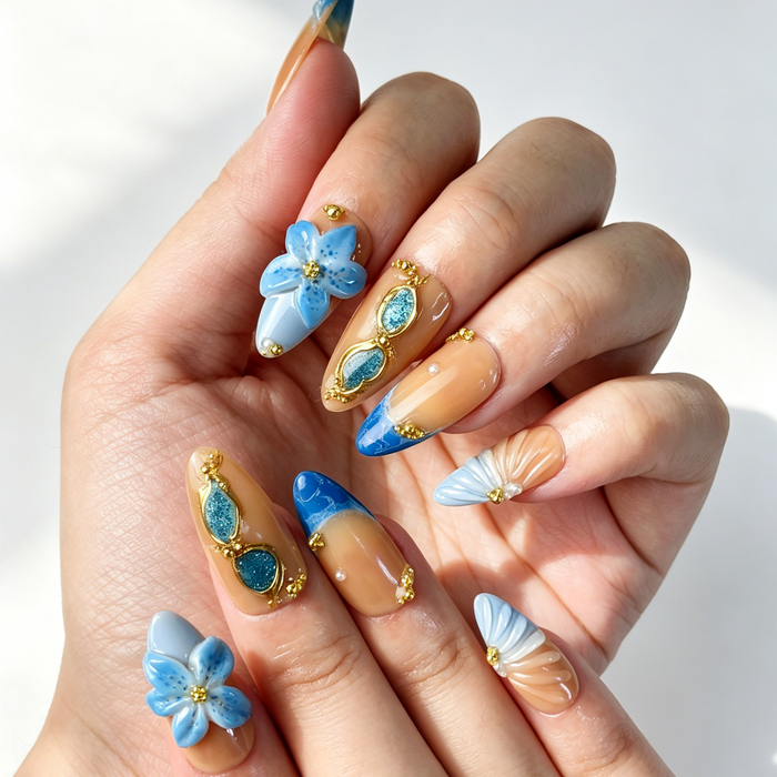 Close Up 3D Embossed Nail Art, Blue Floral Gold Chain Pearl Decor, Medium Almond Nude Orange Gradient Press On Nail Detail Shot