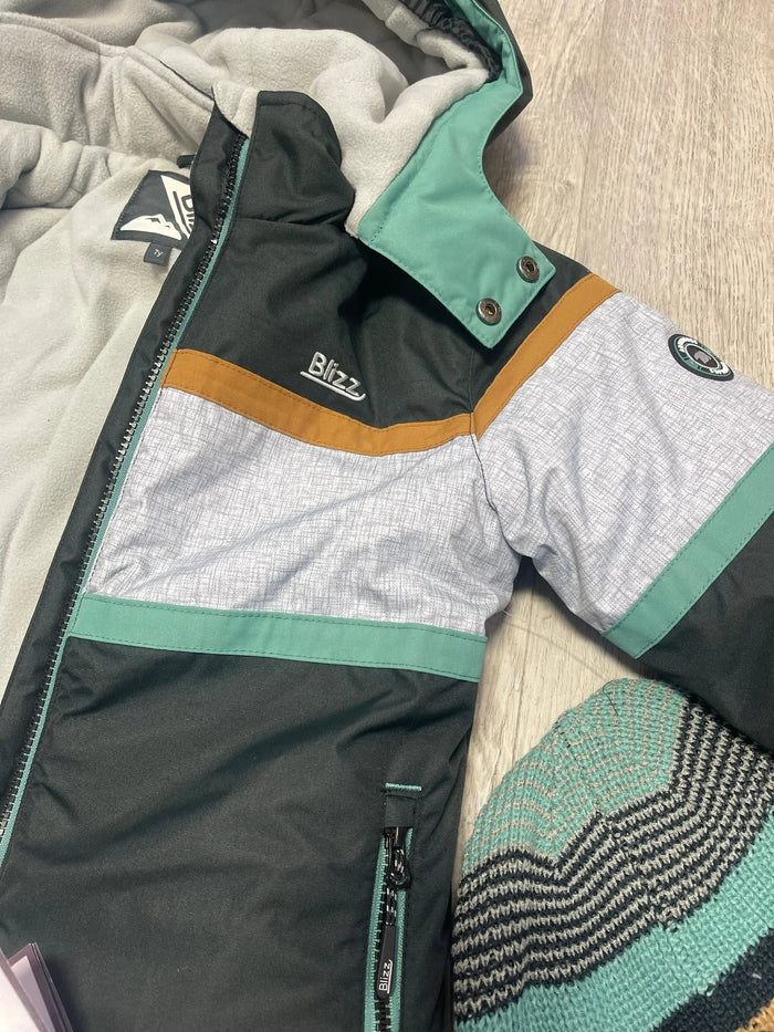 Close-up of Blizz boys snowsuit jacket sleeve and color-block winter outerwear detail.