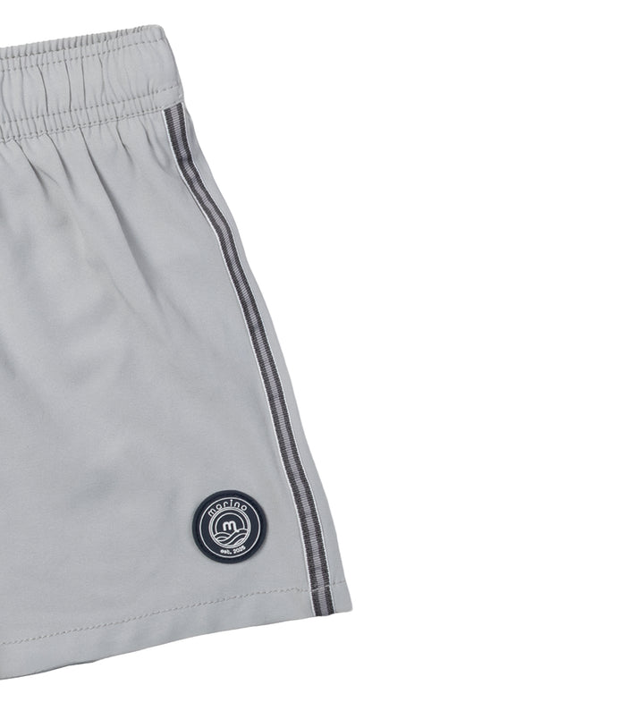 Gray shorts with gray drawstrings side trim detail and a logo on a white background