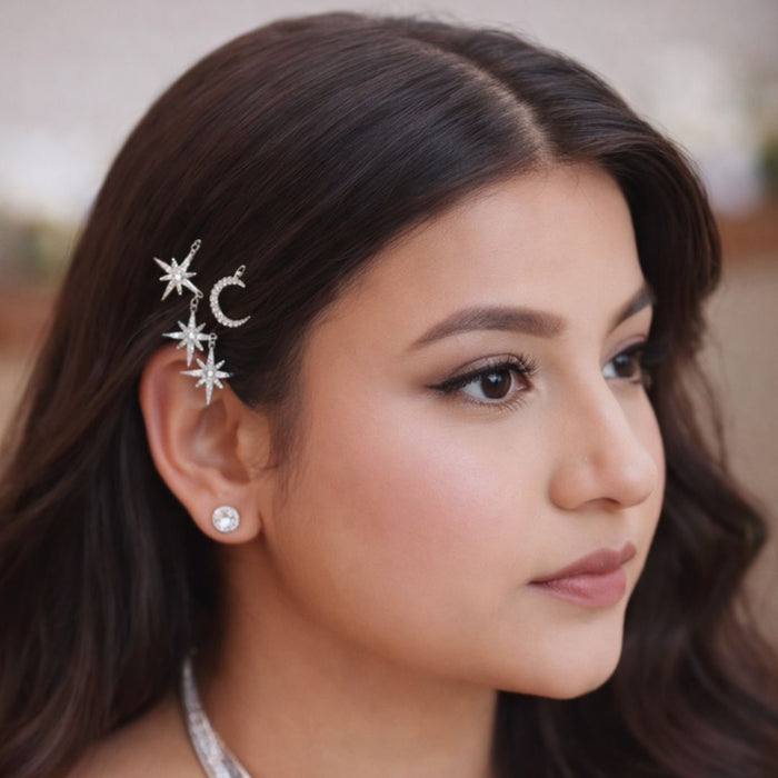 Set of 8 celestial U pins with stars and moons tucked into messy bun for cocktail party look