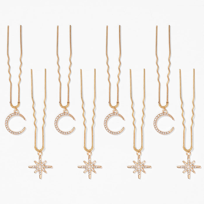 Sparkly star and moon U pins holding festival braid together with subtle celestial hair vibes