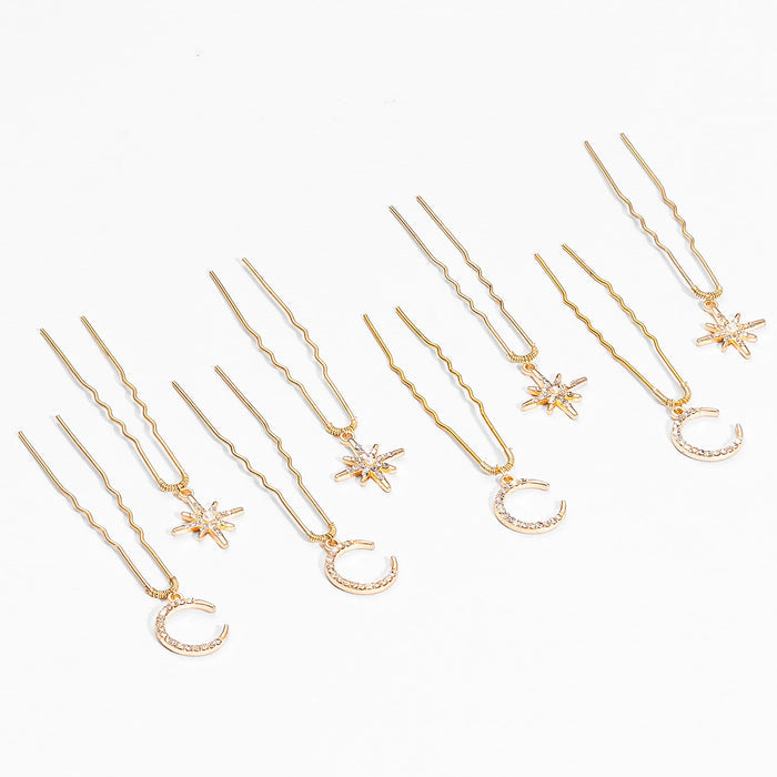 Delicate gold star moon pins scattered through soft updo hairstyle for sufi night celebration