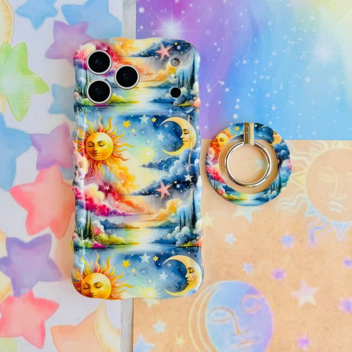 Cosmic Daydream celestial MagSafe phone grip ring with watercolor illustration of a personified sun, crescent moon, and stars in a dreamlike landscape compatible with iPhone and Samsung