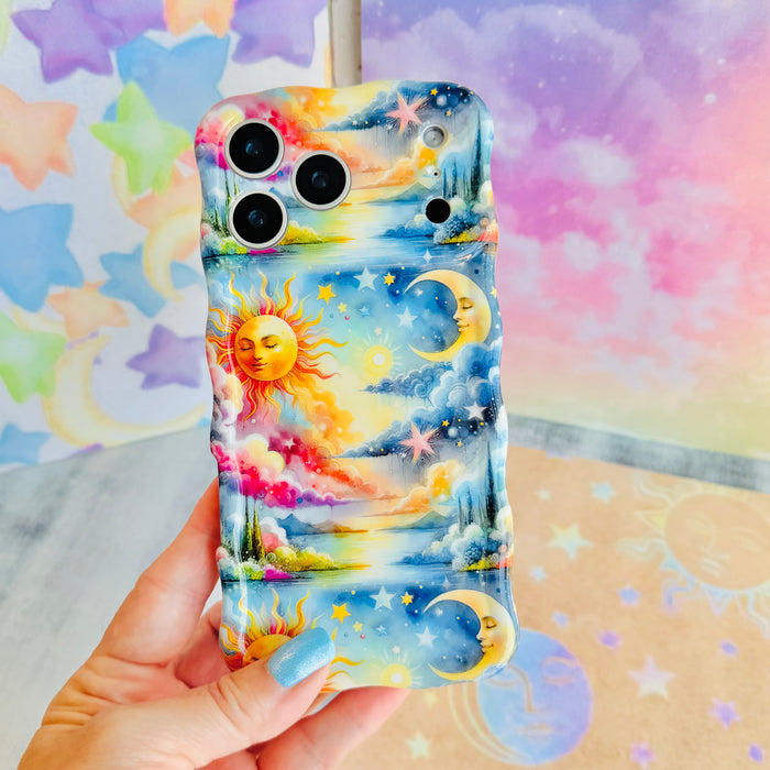 Trendy wavy iPhone case featuring a vibrant celestial surrealism design of a golden sun, crescent moon, and pastel watercolor clouds with a high-gloss finish.