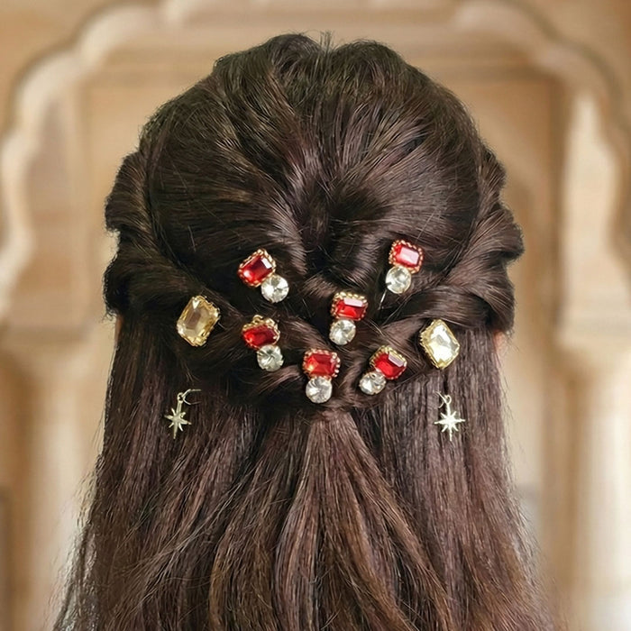 Red crystal hair pins with silver star charms styled in messy bun for instant daily glam