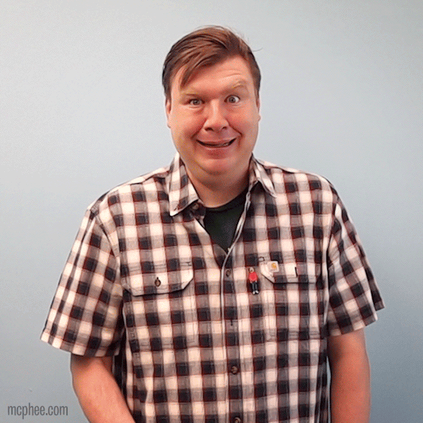 A man with humorously bulging eyes, reminiscent of a hand-painted cartoon, stands in front of a light blue background while wearing a plaid shirt. This scene evokes the playful charm of the Deluxe Rubber Chicken.