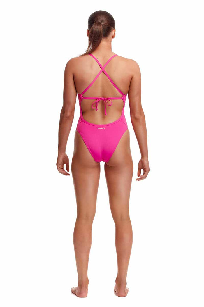 Pink Funkita Ladies Candy Tie Me Tight One Piece Swimsuit displayed on a model, showcasing the colorful swimwear design.