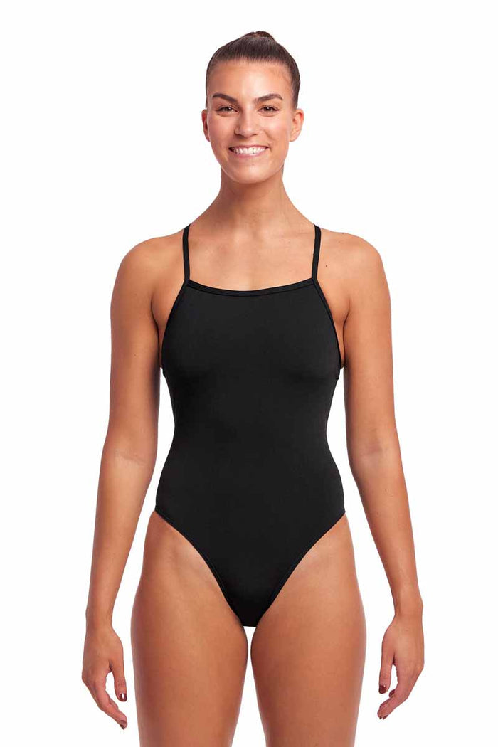 Funkita Ladies Still Black Tie Me Tight one-piece swimsuit in black, featuring a sleek, fitted design for active swimming.