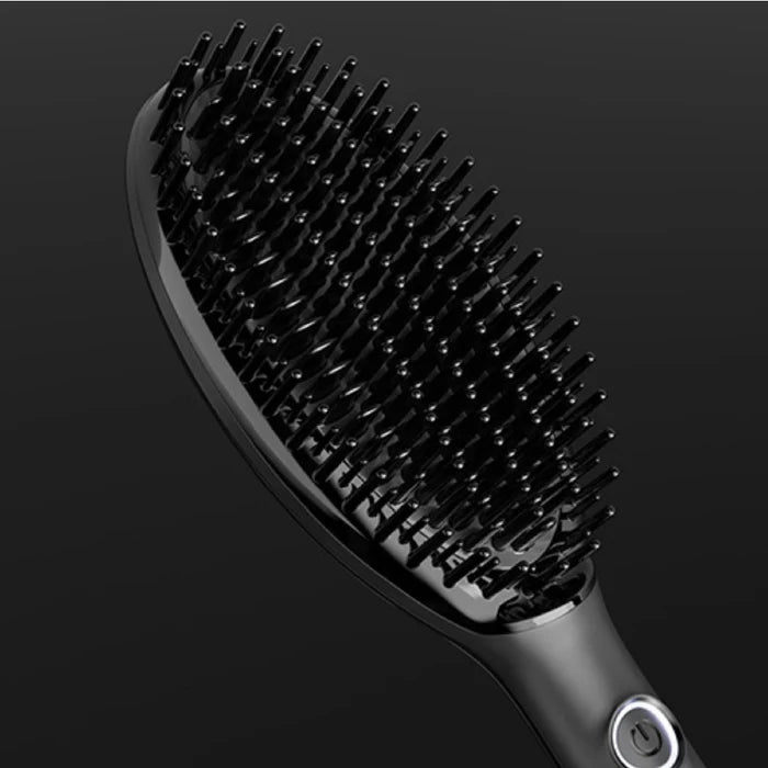 Black hairbrush on a dark background