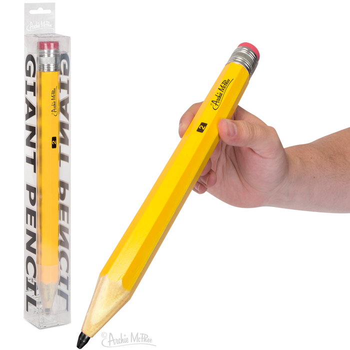 A hand holding a Giant Wooden Pencil with an eraser, beside its packaging, perfect for tackling huge crossword puzzles.