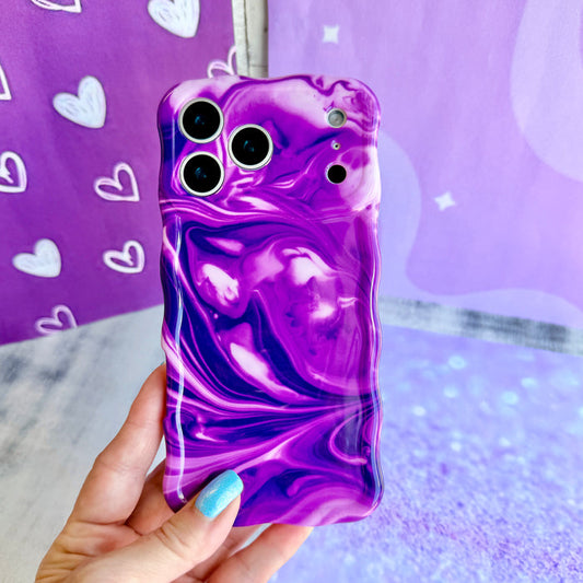 Grape Crush Wavy Luxe MagSafe iPhone case with a glossy purple liquid marble swirl design from Fancy Bands