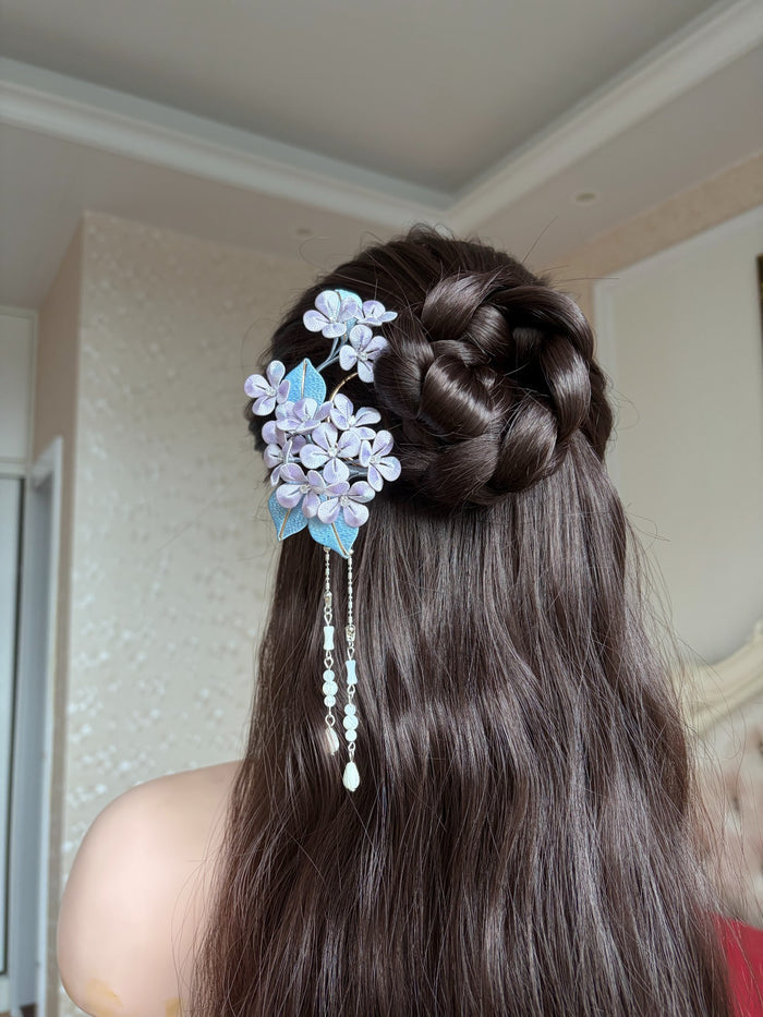 A woman wearing a handmade Chanhua silk hydrangea hairpin with beaded tassels-2