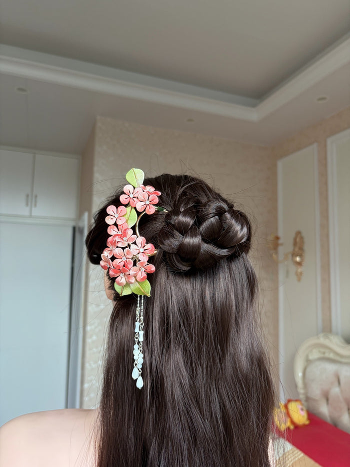 A woman wearing a handmade Chanhua silk hydrangea hairpin with beaded tassels-3
