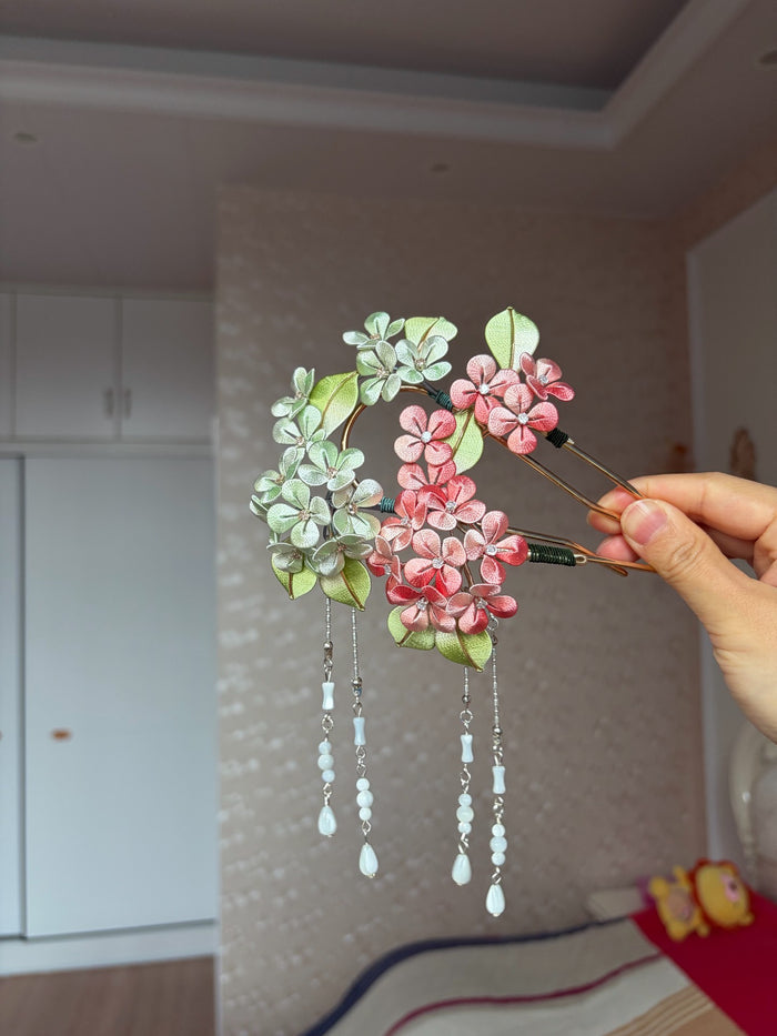 A woman wearing a handmade Chanhua silk hydrangea hairpin with beaded tassels-4