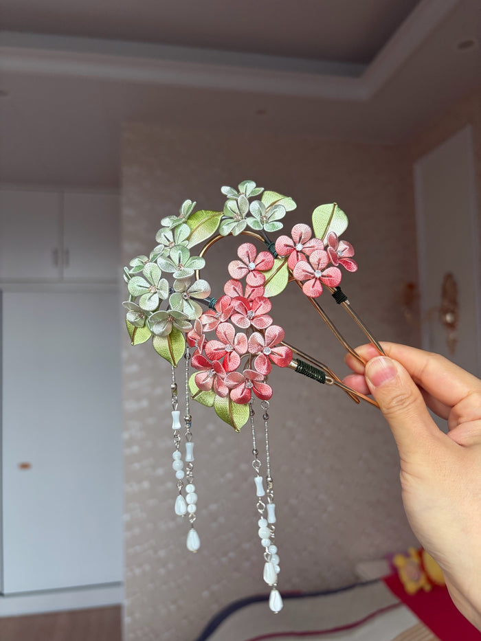 A woman wearing a handmade Chanhua silk hydrangea hairpin with beaded tassels-5