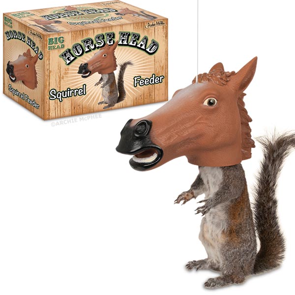A comical squirrel dons a horse head mask while perched beside the box marked as the Horse Head Squirrel Feeder.