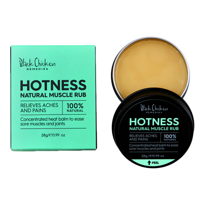 Open container of natural vegan heat balm for sore muscles next to its box.