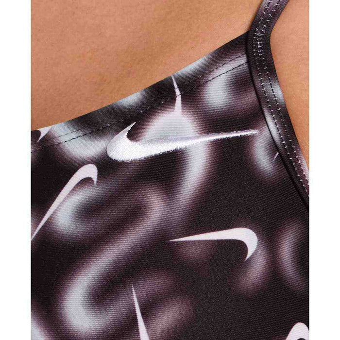 Black Nike Hydrastrong Sprayfetti print cutout one-piece swimsuit with bold pattern and sleek design, ideal for swimming and beachwear.