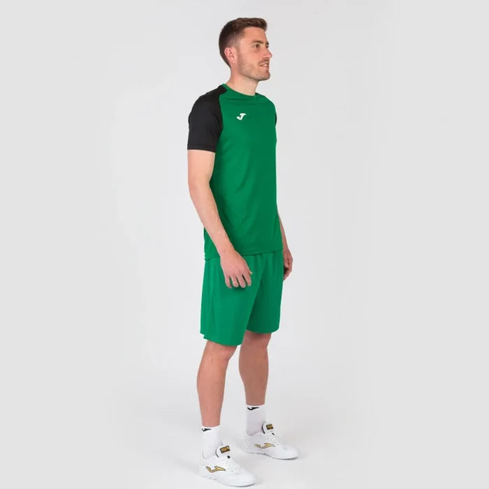 Joma men's Academy IV T-shirt in green and black, casual athletic fit, made of breathable fabric, displayed flat.