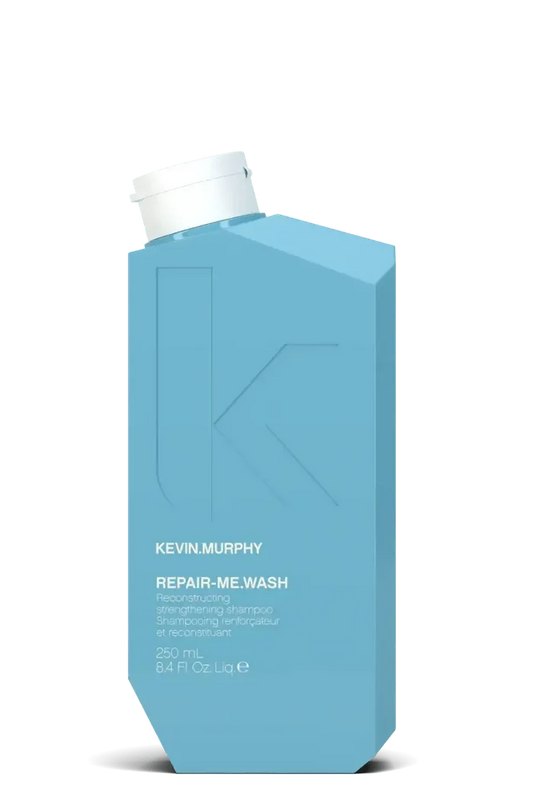 Blue bottle of Kevin Murphy Repair Me Wash on a white background - Hair Care Canada