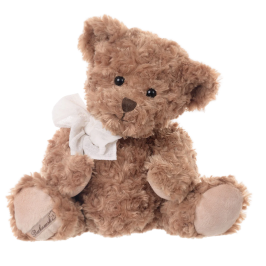 Brown teddy bear with a white bow tie on a white background