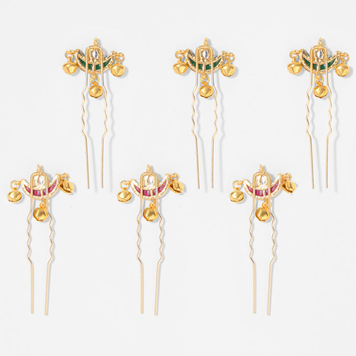 Elegant gold bridal hair pins with ghunghroos adding movement and charm to festive hairstyles