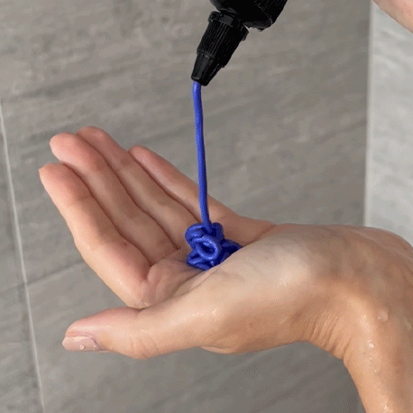 Gif of someone pouring the Alcôve Hair Violet Conditioner in their palm