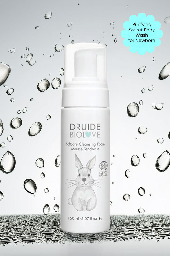 Druide Biolove Organic Baby Wash Cleansing Mousse dispenser against background if water beads with text "purifying scalp and body wash for newborn".