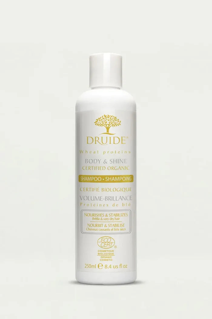Druide Body & Shine Shampoo for Dry & brittle hair flip top dispenser against clear background.