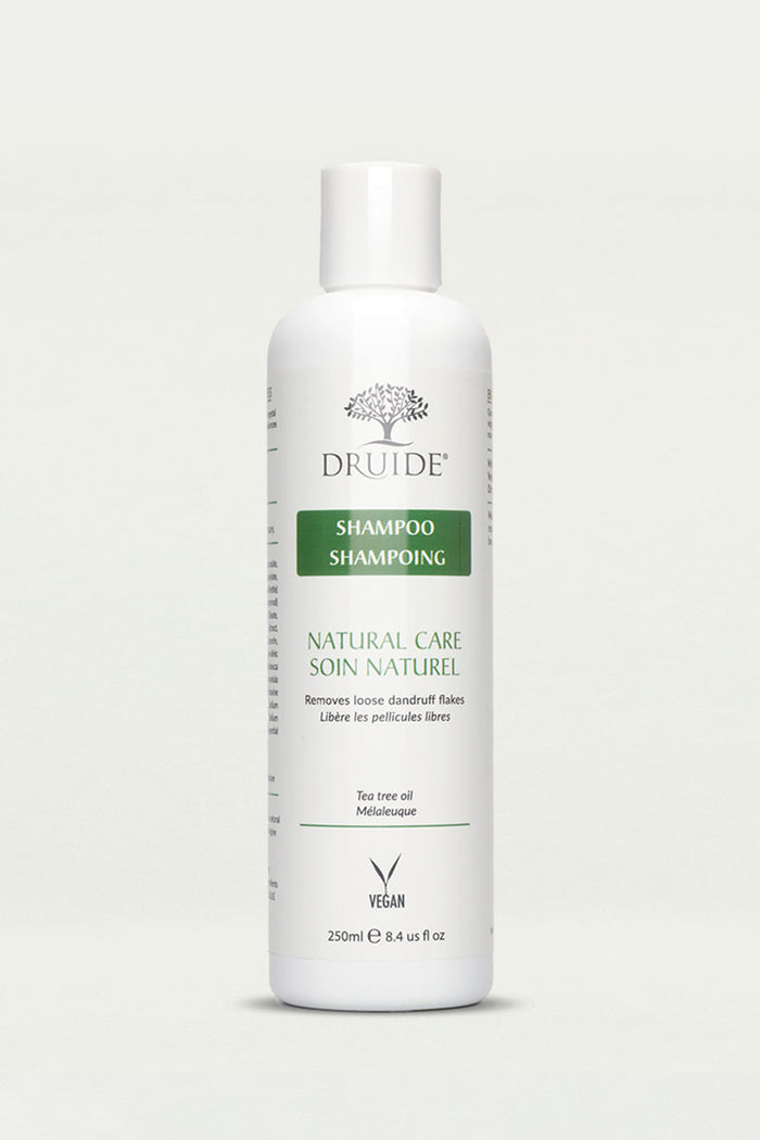 Druide Tea Tree Oil Shampoo for Dandruff 250 ml flip top white dispenser shown against a clear background.